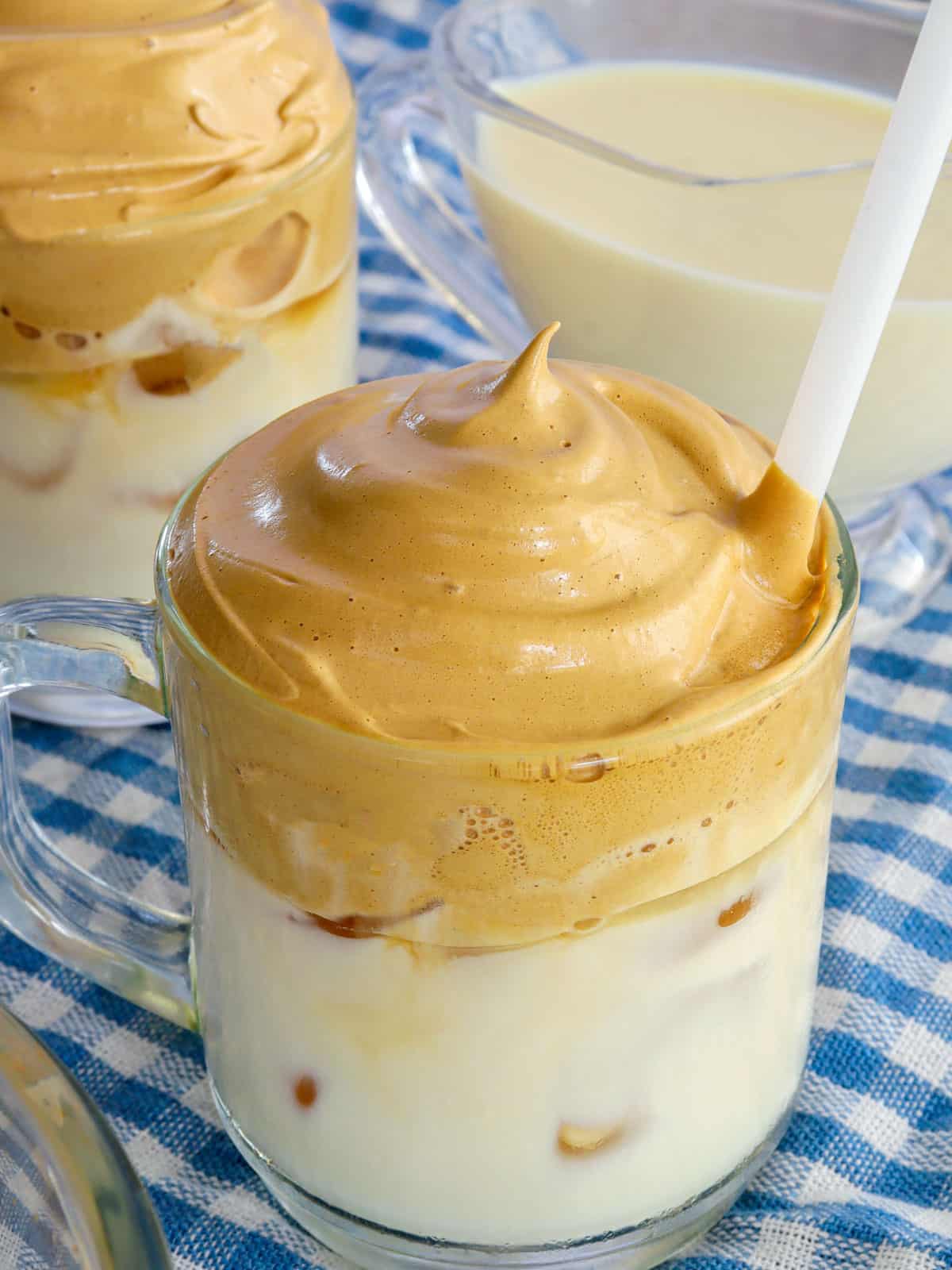 Dalgona Coffee in a glass mug.